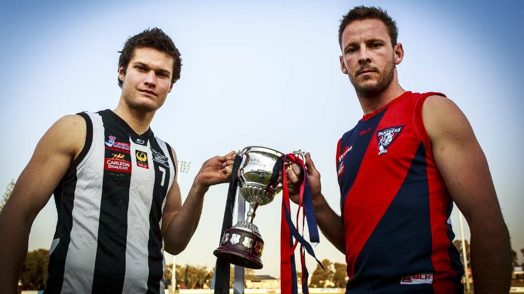 Busselton captain Jon Meadmore and Carey Park captain Jake O'Mara face off with the trophy their teams are chasing in Sunday's grand final. Photo: Ashley Pearce.