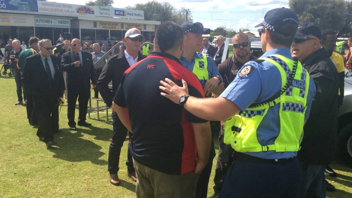 Police escorted a Carey Park from the ground following an alleged assault on an umpire after the reserves grand final.