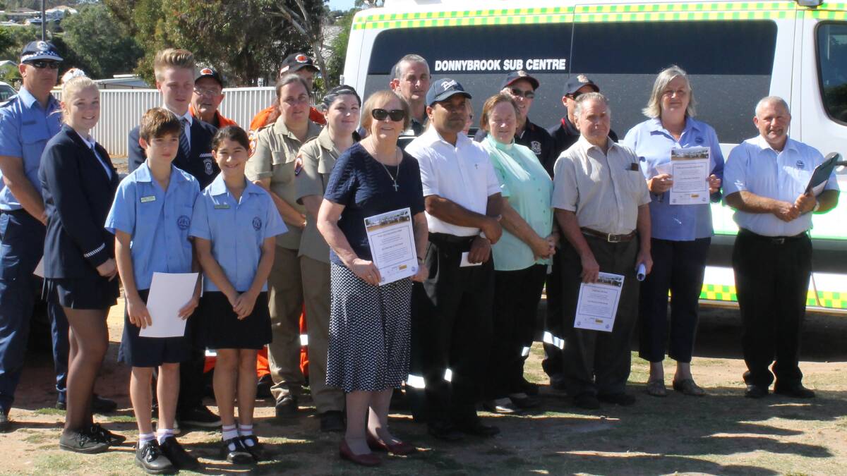 Community members gather outside Donnybrook IGA to promote road safety over Easter. 