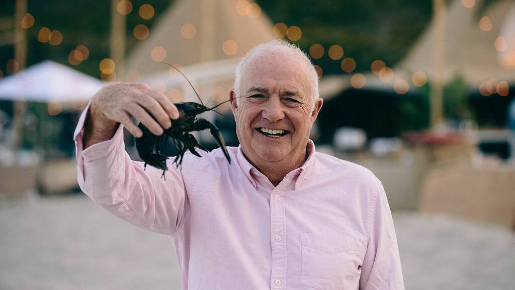 Chef Rick Stein meets a local on the beach at Meelup during Gourmet Escape. Photo: Elements Margaret River