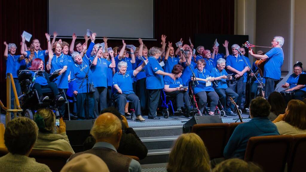 Passion for music: Musical director Bernard Carney conducts the SOS Choir, 2018. Photo: Supplied.