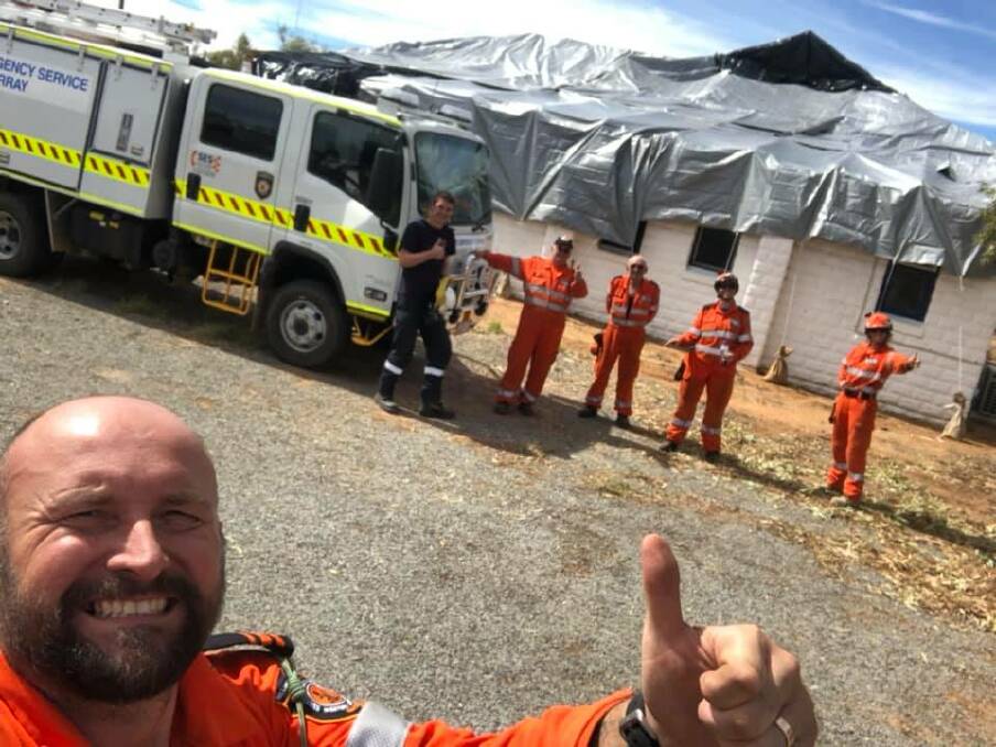 Great job: The Murray SES team after tarping a house. Photo: Supplied.