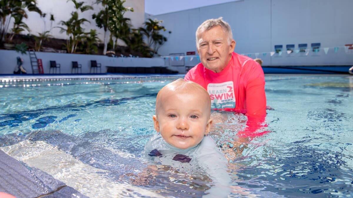 Never too young: Laurie Lawrence from Kids Alive teaching a toddler to swim. Photo: Supplied.