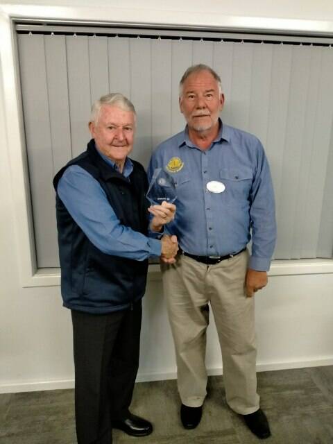 Impressive achievement: Garry Irvine receives his 50 years of service award. Photo: Supplied.