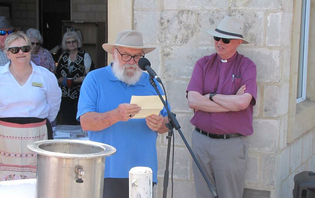 Memories: Fr Joe Hopkins reading the letter he placed in the time capsule. Photo: Supplied.