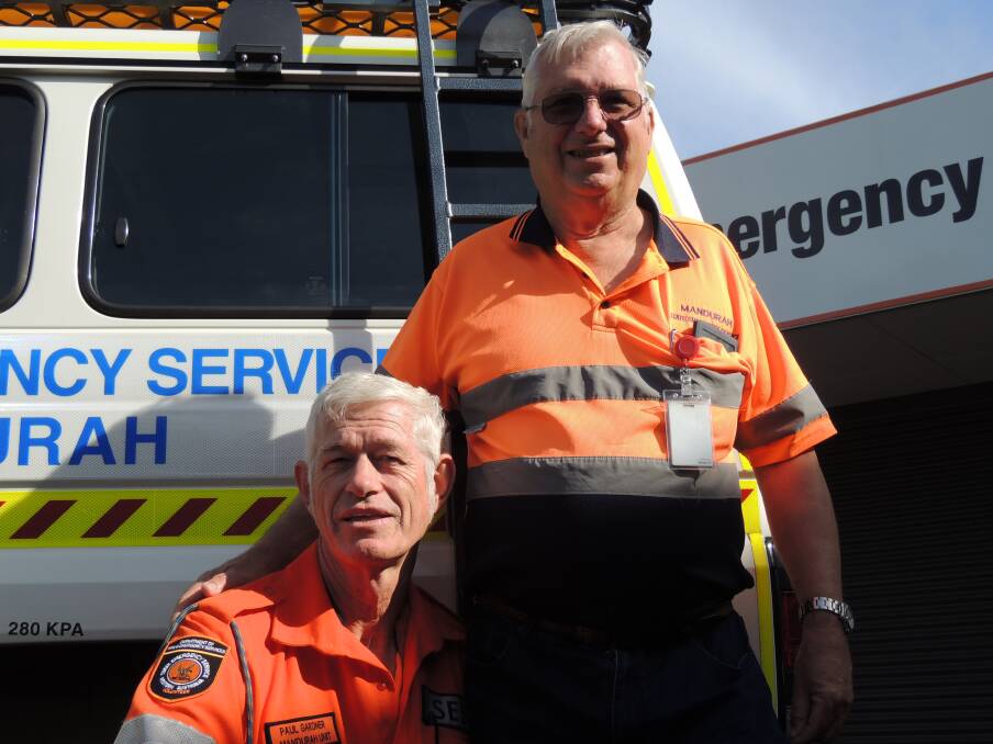 Community heroes: Volunteer rescuer Paul Gardner and deputy manager Phil Rance. Photo: Shannon Lawson.