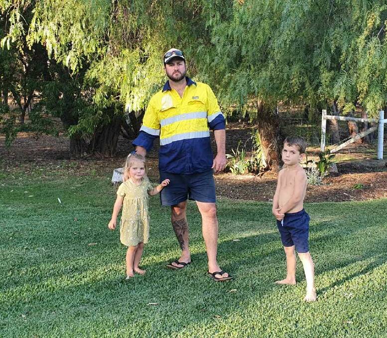 Mozzie attack: Parklands resident Cade Broomhall and his children Lily and Logan have been battling mosquitos at their property this season. Photo: Supplied.