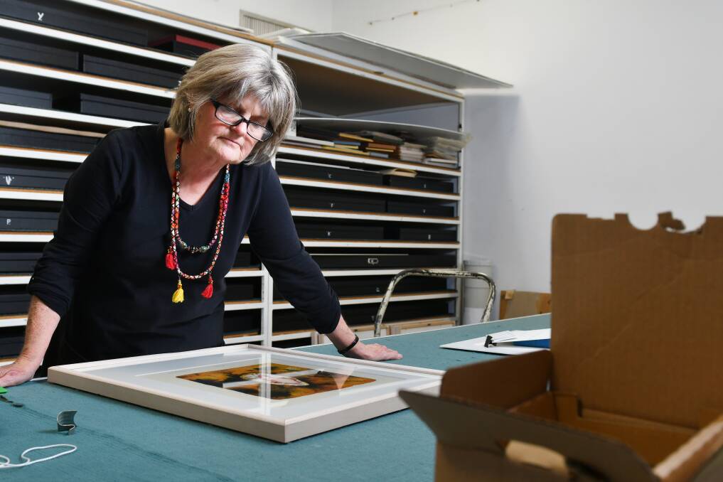 IN PRINT: Burnie Regional Art Gallery director Dawn Oelrich surveys a work in the print work store room. Picture: Brodie Weeding