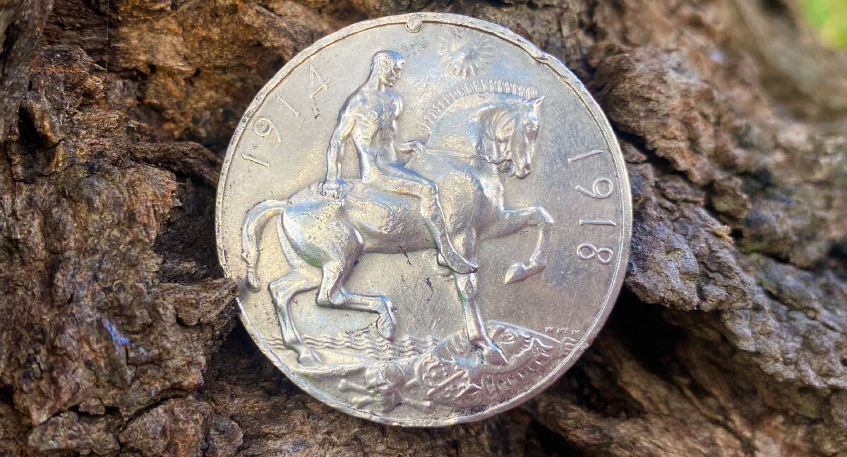MEMENTO: The World War I service medal shows a horse and rider stamping on the enemy on one side.