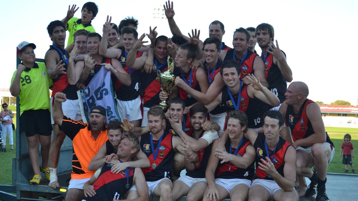The Waroona Demons celebrating after their fourth premiership win in a row on Sunday at Bendigo Bank Stadium.