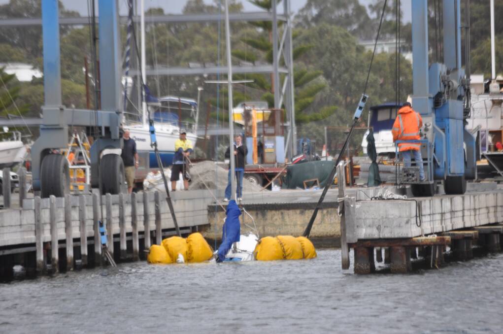 IT WASN'T quite the raising of the Titanic but this morning's operation to float a sunken yacht in Mandurah's Ocean Marina still managed to draw a crowd.