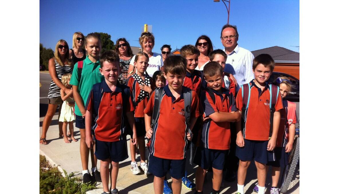 Not safe to cross: Mandurah MLA, parents and students gathered this morning to rally over the lack of crossing guards on Oakmont Avenue, Meadow Springs.