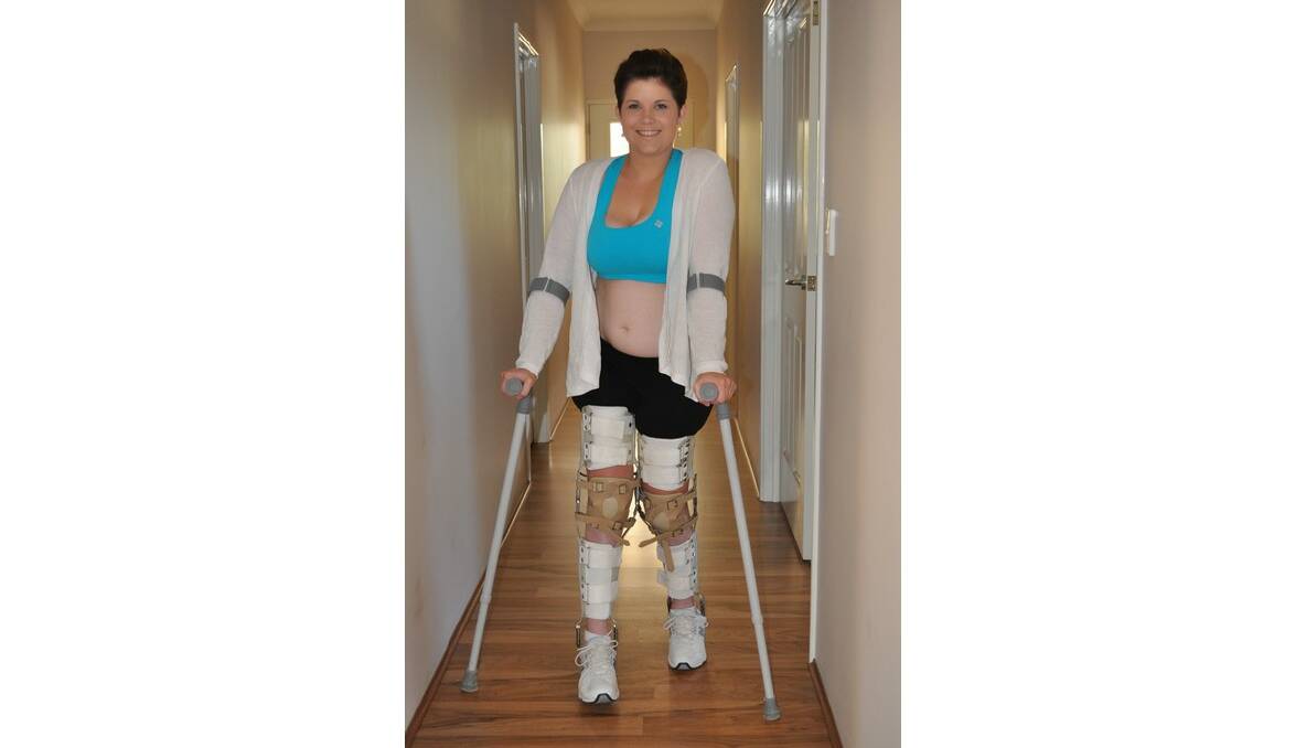 Walking tall: Tayla Stone is proving experts wrong and has started walking after three years confined to a wheelchair.
